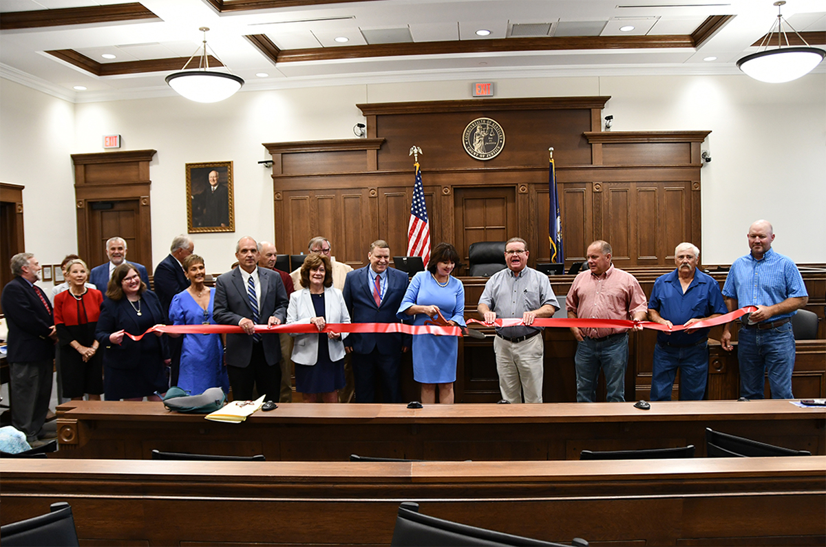 A ceremony of the ribbon cutting with Chief Justice Debra Lambert.