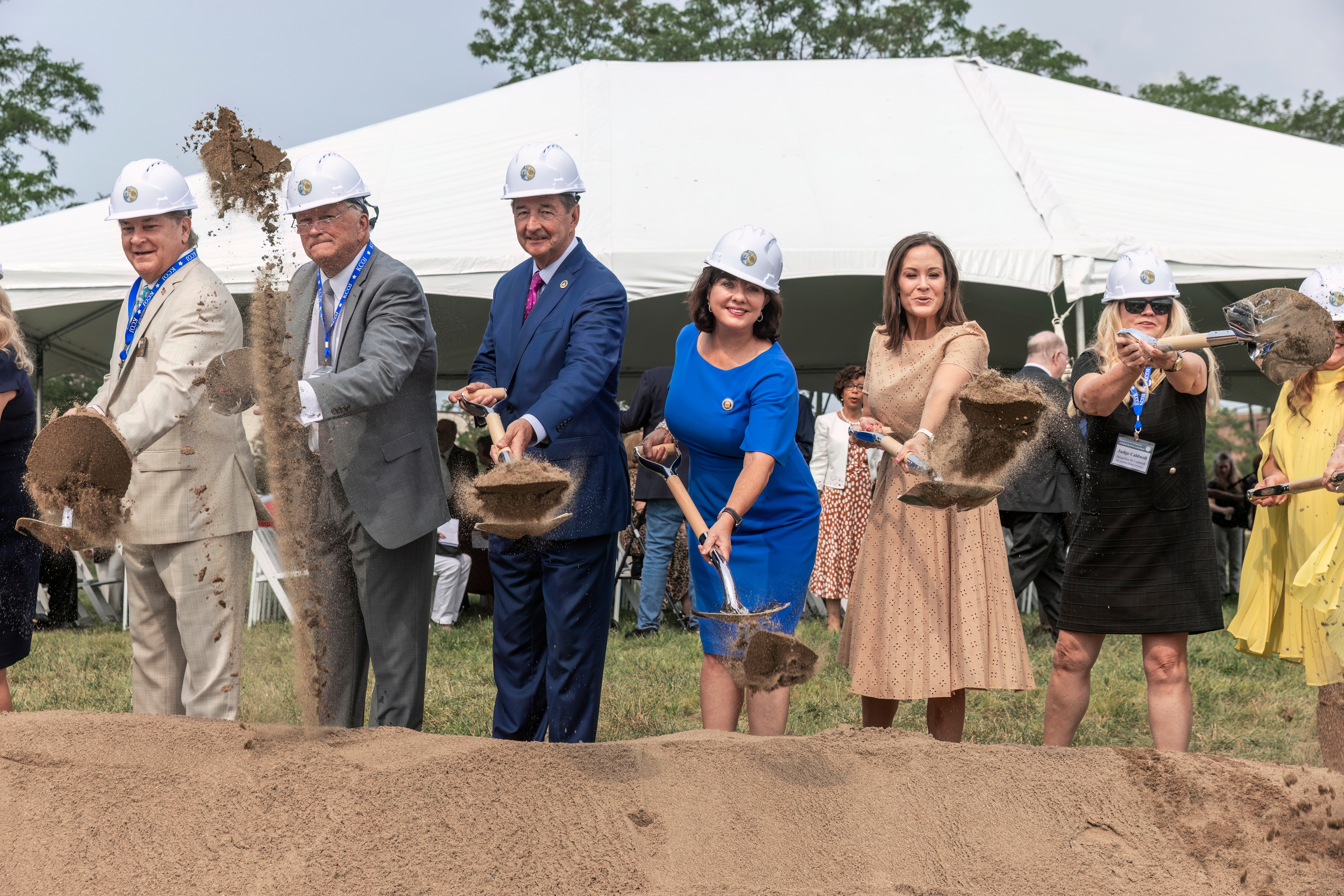 Chief Lambert next to Lt. Governor Jacqueline Coleman and Rocky Atkins digging dirt.