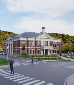 Modern brick and beige courthouse with small bushes in front.
