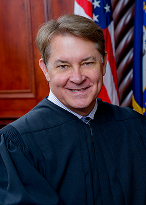 Official portrait of Judge Glenn E. Acree.