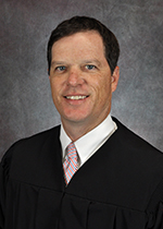 Official portrait of Judge Roger Knoth. 