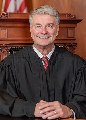 Official portrait of Justice Robert B. Conley.