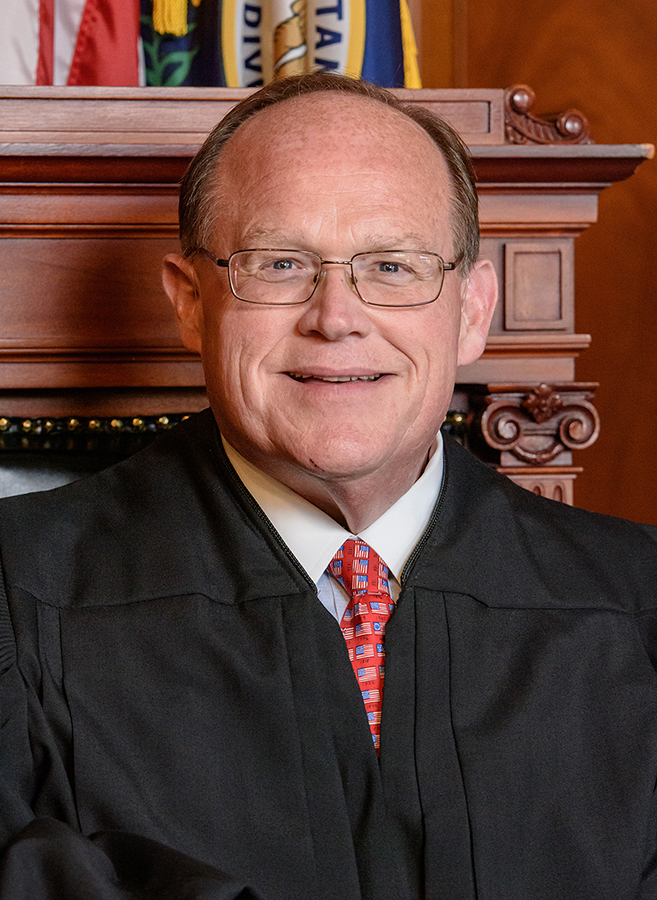 Official portrait of Justice Shea Nickell.